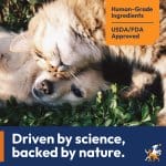 A promotional banner with an image in the middle featuring a dog and cat laying on green leaves snuggling with their heads together. The dog is looking at the camera with one eye while the cat is snuggling it's head over the other day. The right top has an orange tag that says Human-Grade Ingredients, and USDA/FDA Approved. The bottom has a blue banner with the text Driven by science, backer by nature.